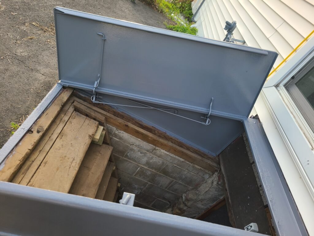 Refinished bulkhead door open, showing the wood supports underneath