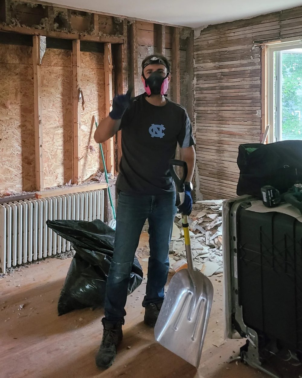 Andrew McRichards, founder of Granite Coast Home Services, wearing a respirator during interior demolition